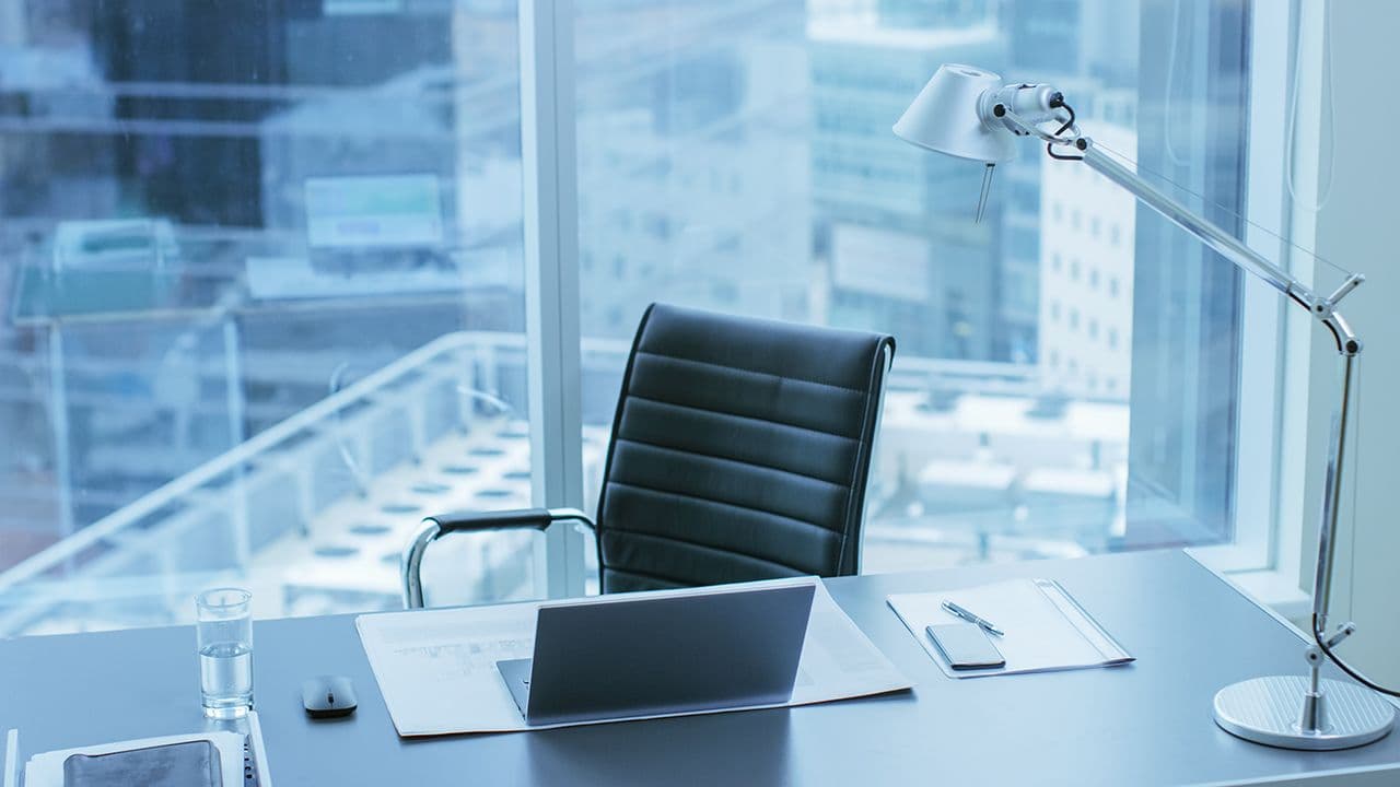 High Angle Shot of a Working Desk of an Successful Person in Office with Cityscape Window View. | Image credit: © Gorodenkoff - stock.adobe.com