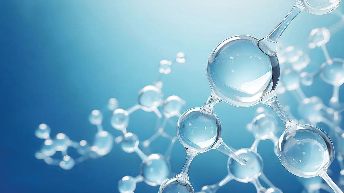 Colorful 3D glass molecules and atoms in blue background. | Image Credit © Drawbot/Stock.Adobe.com