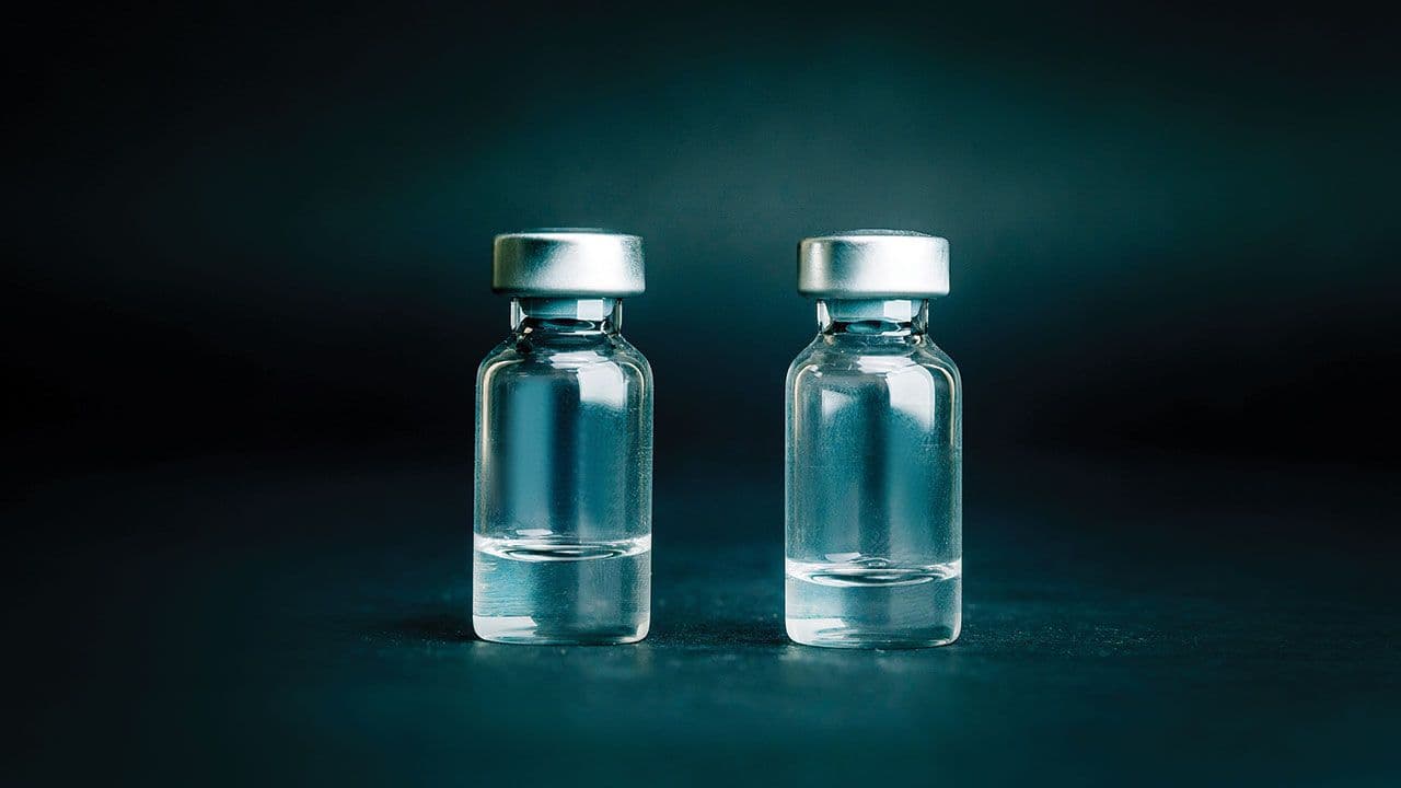 close up. two medical ampoules on a dark background. | Image Credit: ©yurolaitsalbert/Stock.Adobe.com